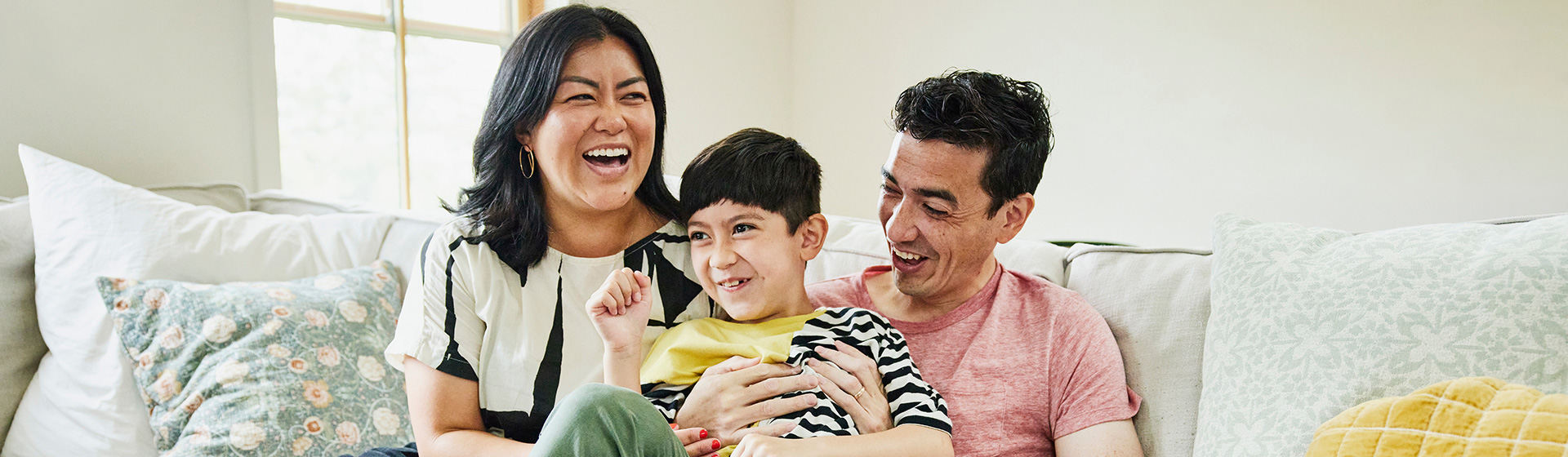 Mother, Son, and Father Laughing