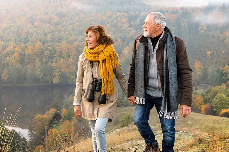 Older couple hiking outside